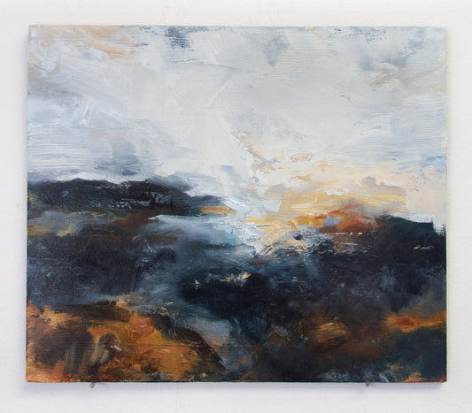 Dark landscape with orange accents at sunset