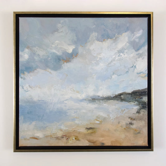 Coast with beach and clouds in frame