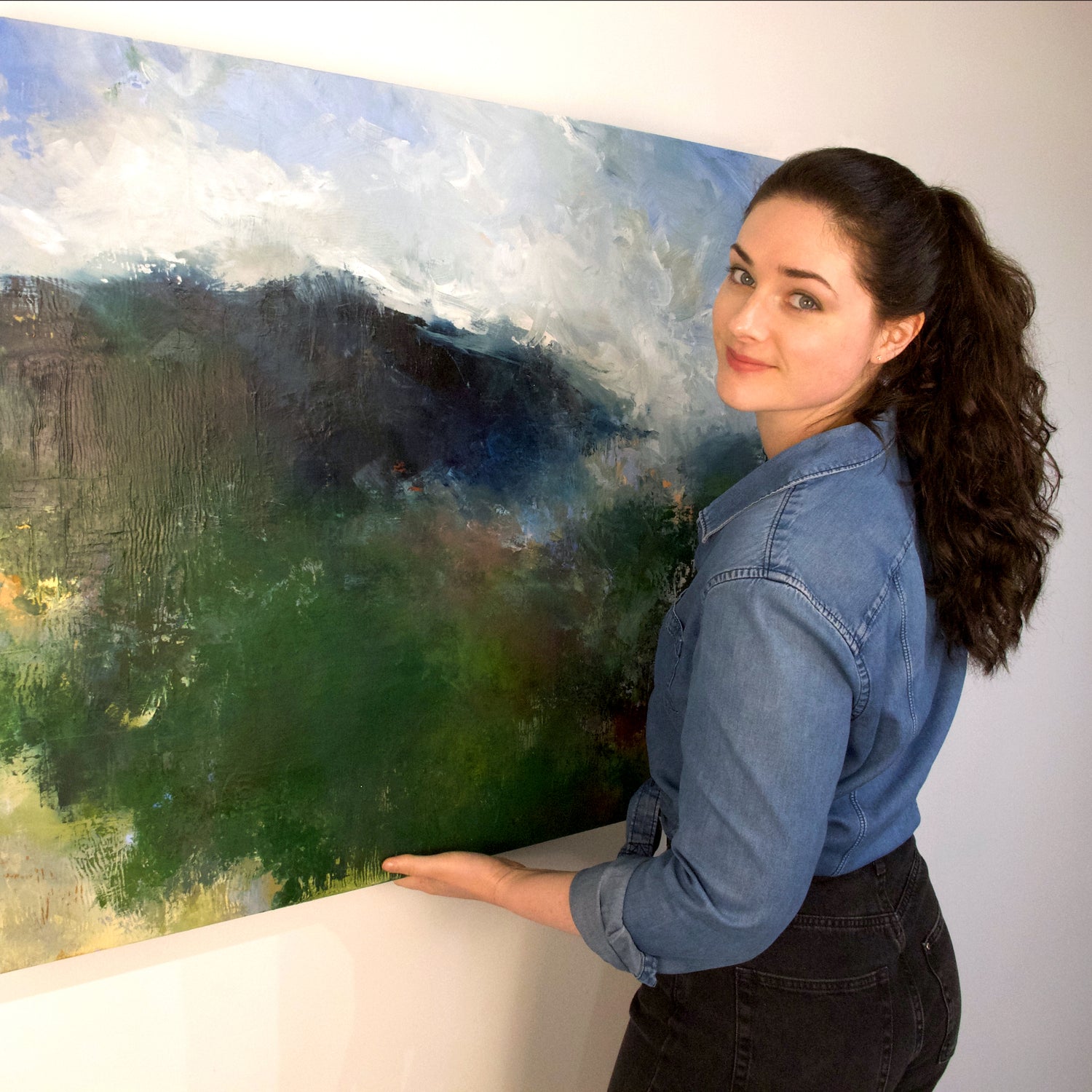 Meg holding large painting
